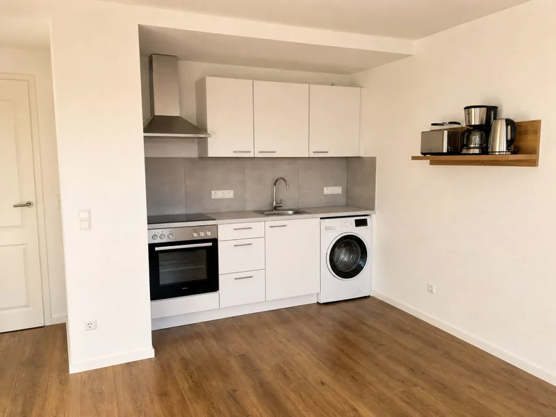 Küchenzeile mit Backofen und Waschmaschine